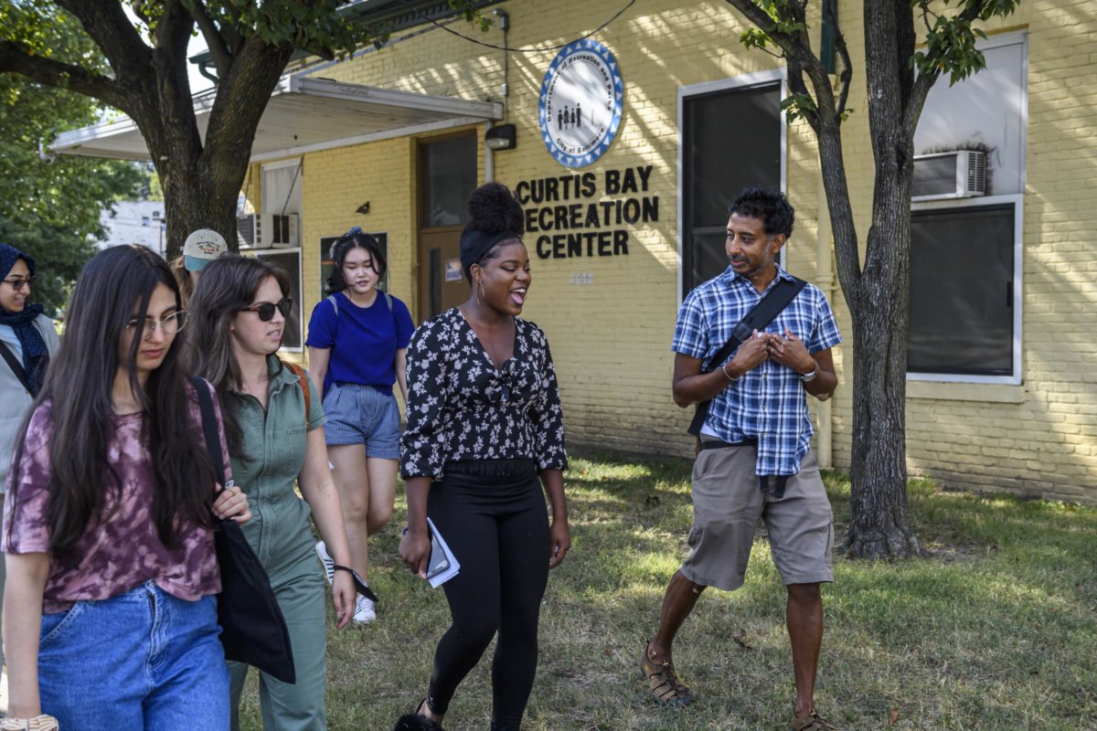 Photo features EDC Curators Shashawnda Campbell and Anand Pandian and their students outside the Curtis Bay Recreation Center