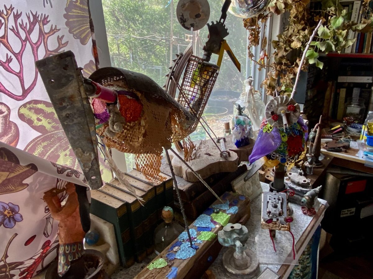 A sculpted bird fabricated with discarded metal and other materials